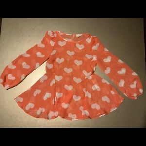 A Peach camisole that see through with White hearts
